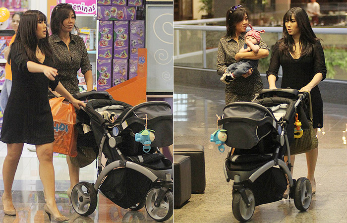 Daniele Suzuki passeia com o filho e com a irmã em Shopping Carioca