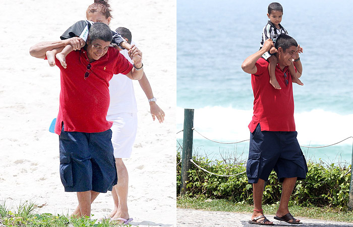 Zeca Pagodinho se diverte com seu netinho na praia, no Rio