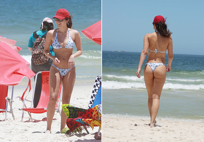 Ana Carolina Dias mostra boa forma em praia 