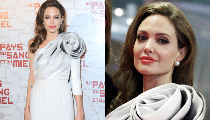 Sem sinal de gravidez, Angelina Jolie usa vestido justo em première