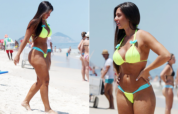 Nicole Bahls exibe suas curvas em praia carioca