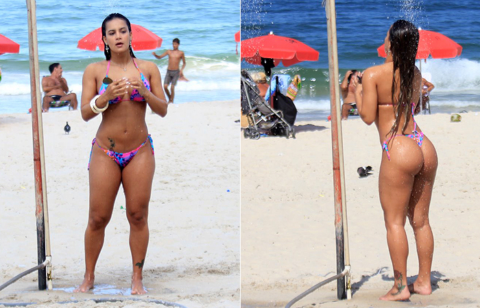 Musa do Brasileirão brinca com criança no mar de Ipanema, no Rio