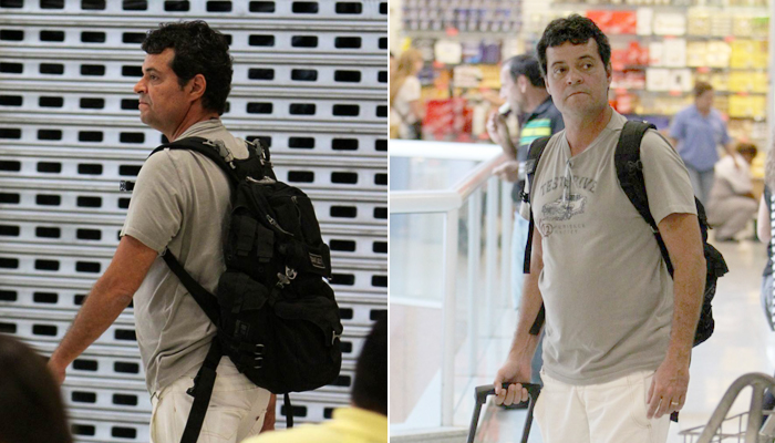 Felipe Camargo circula em aeroporto no Rio de Janeiro