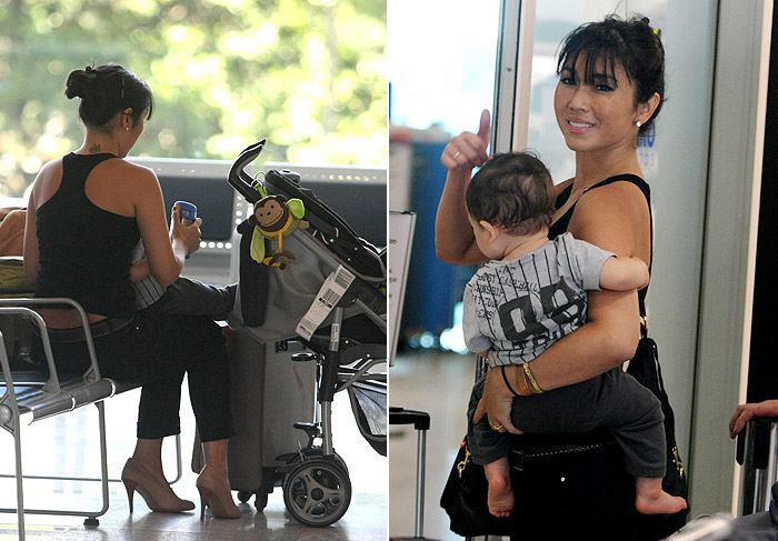 Daniele Suzuki troca a fralda do filho no aeroporto