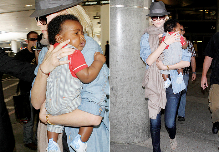 Charlize Theron é flagrada em aeroporto com seu filho no colo