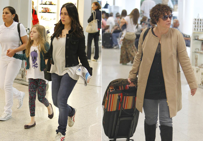 Sorridente, Carolina Ferraz embarca em aeroporto carioca