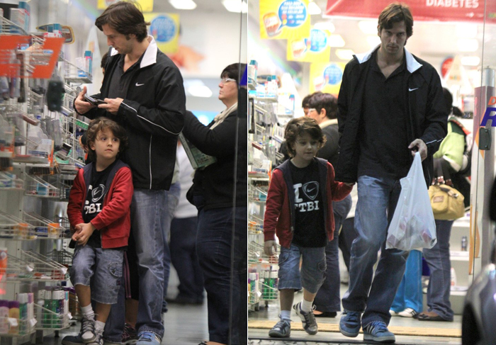Vladimir Brichta faz compras na farmácia com o filho