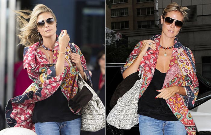  Heidi Klum enfrenta o vento ao sair de aeroporto em Nova York