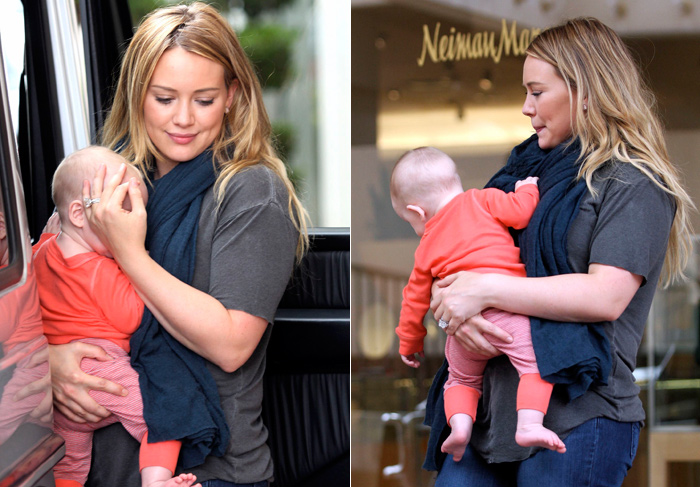 Hilary Duff tenta esconder rosto do filho durante passeio