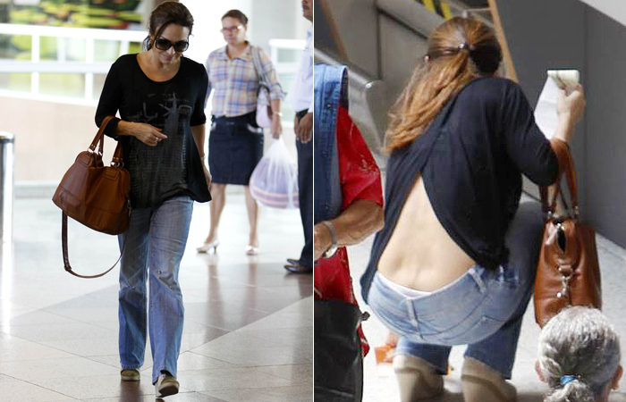 Luiza Tomé mostra parte da calcinha durante agachada em aeroporto
