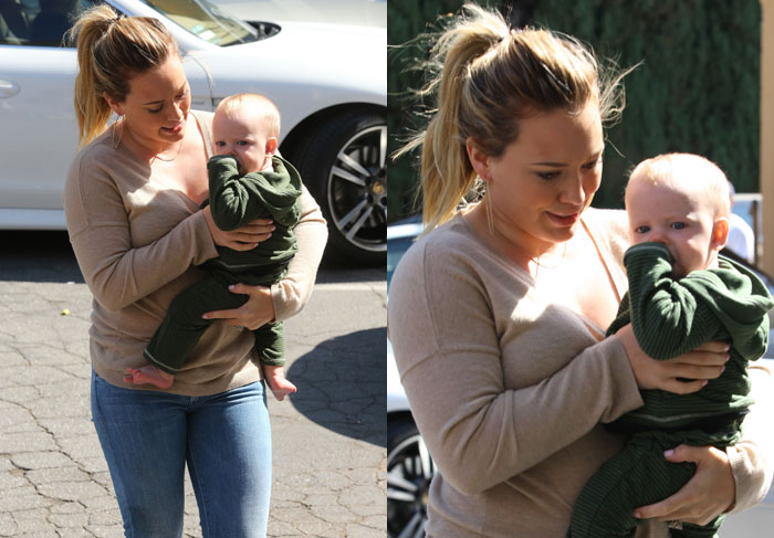 Filho de Hilary Duff chupa o dedo durante passeio com a mãe