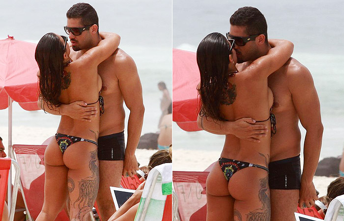 Ex-BBB Yuri Fernandes beija muito morena tatuada na praia