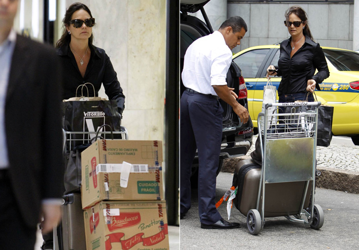 Luiza Brunet desembarca no Rio com caixas de panetone