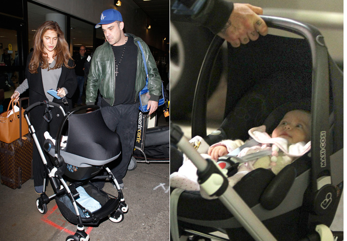 Filha de três meses de Robbie Williams chama a atenção em aeroporto