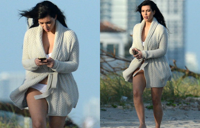 Após ser flagrada em praia, Kim Kardashian fotografa paparazzo dormindo