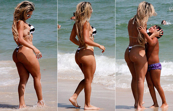 Andréa de Andrade mostra suas belas curvas na praia da Barra da Tijuca