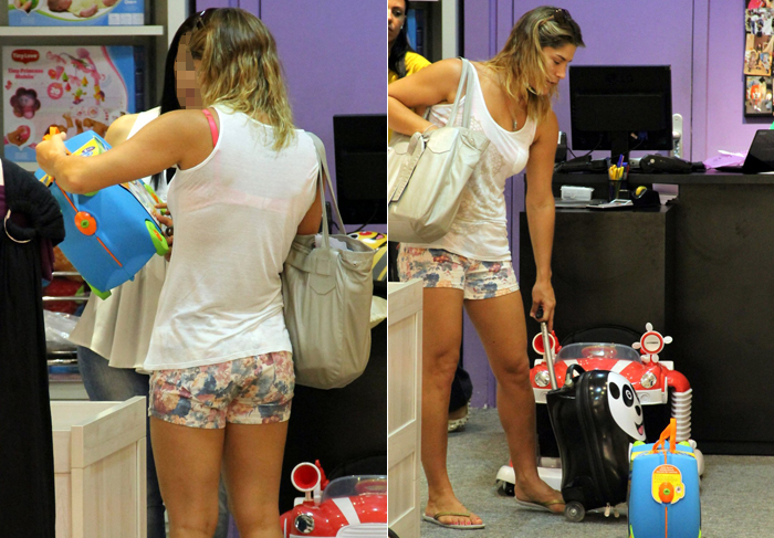 De shortinho, Priscila Fantin faz compras para o filho