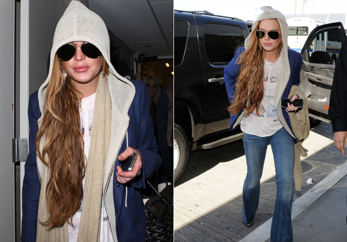 Lindsay Lohan usa capuz para passar despercebida em aeroporto