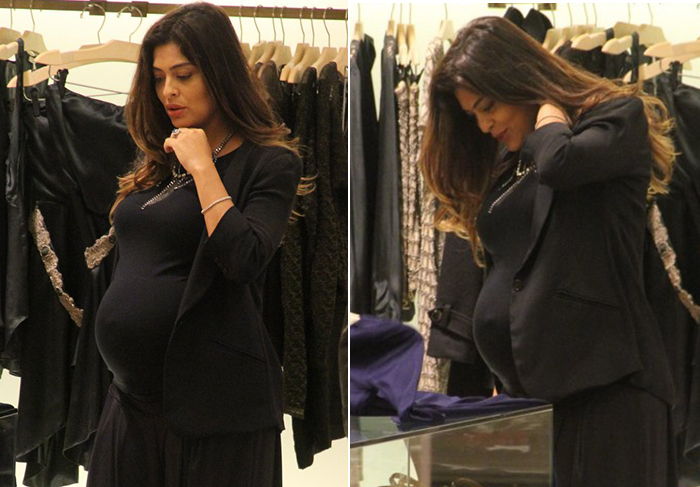 Juliana Paes exibe o barrigão de quase oito meses em shopping