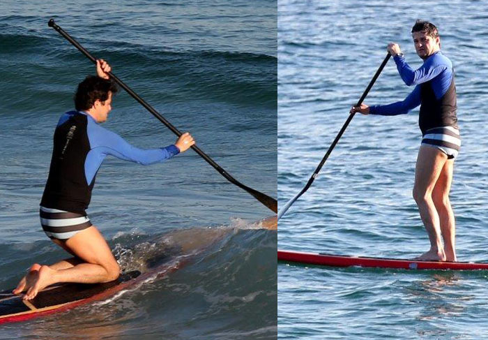 Enquanto os gêmeos curtem praia, papai Marcelo Serrado pratica stand up paddle 