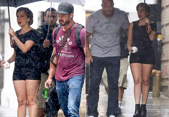 Lady Gaga anda de bota de plataforma na chuva, ao lado do namorado, em NY