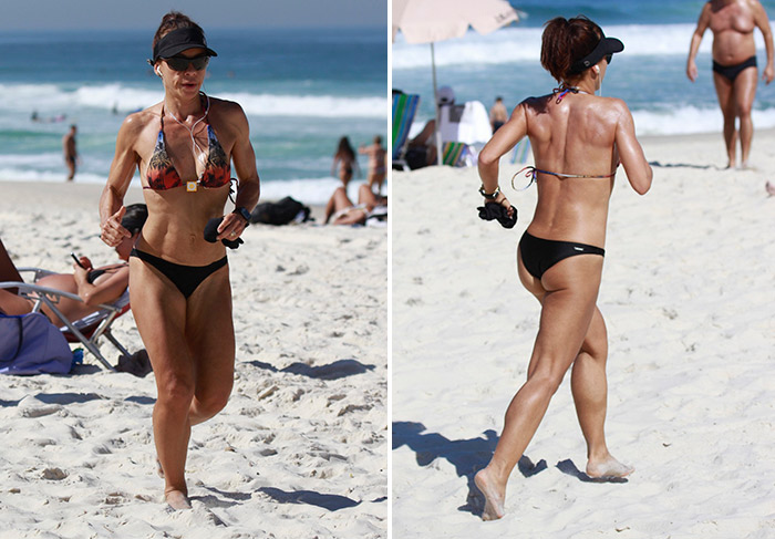 Carla Marins exibe o corpo malhado durante corrida em praia carioca