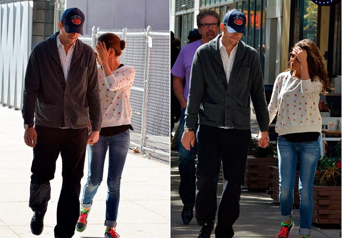 Mila Kunis esconde o rosto durante passeio com Ashton Kutcher