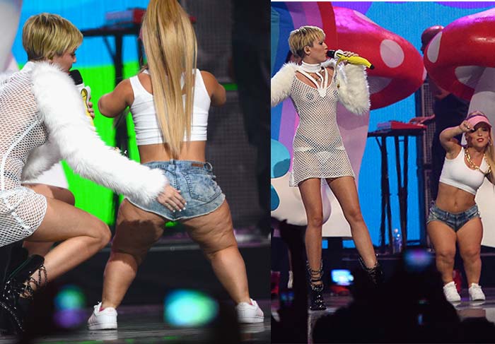 Miley Cyrus canta com seios à mostra, adesivo nos mamilos e microfone banana