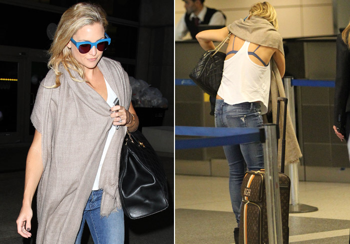 Kate Hudson deixa seu sutiã à mostra em aeroporto
