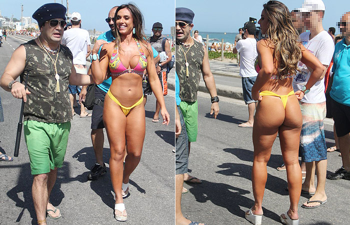 Nicole Bahls exibe o corpaço durante gravação na praia