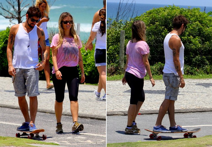 Juliana Didone se exercita com o namorado na orla da Barra da Tijuca