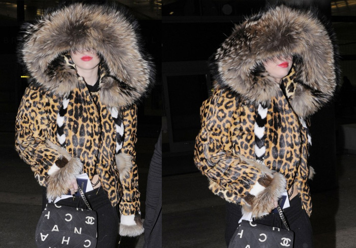 Miley Cyrus se esconde embaixo de capuz do casaco