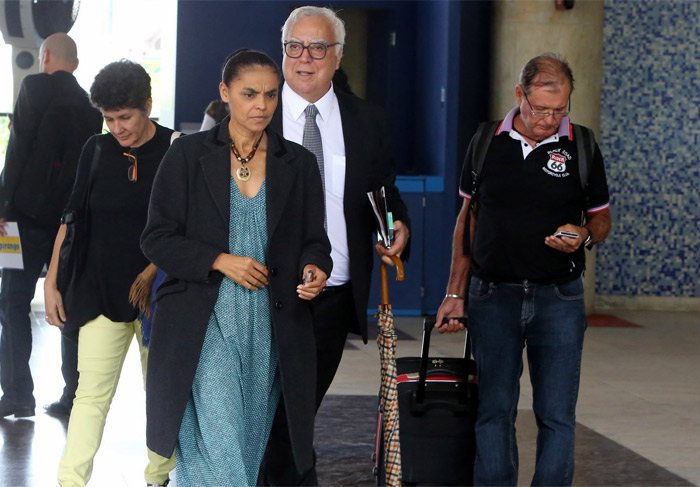 Alexandre Slaviero e Marina Silva desembarcam em aeroporto no Rio