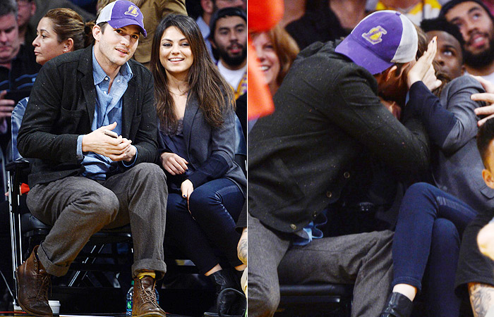 Ashton Kutcher dá beijaço em Mila Kunis durante jogo de basquete