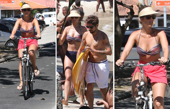  Juliana Didone passeia com o namorado na praia da Barra da Tijuca