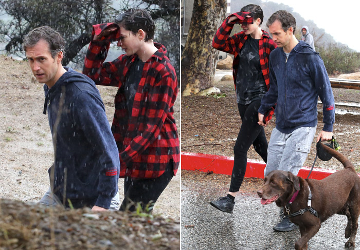 Anne Hethaway faz caminhada na chuva