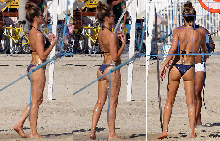 Fernanda Lima joga vôlei e ajeita o biquíni na praia