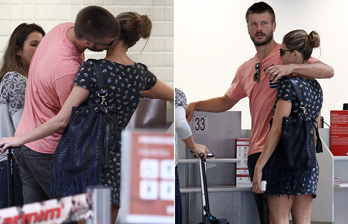 Fernanda Lima e Rodrigo Hilbert trocam beijos e carinhos no aeroporto