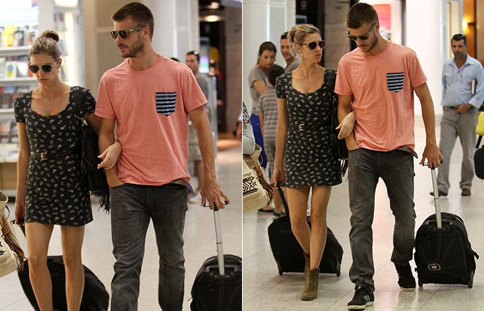 Fernanda Lima e Rodrigo Hilbert trocam beijos e carinhos no aeroporto