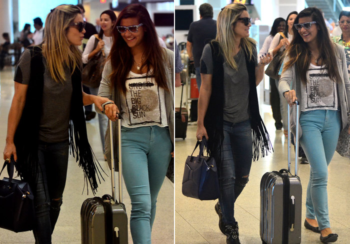 Sorridentes, Flávia Alessandra e a filha embarcam em aeroporto no Rio de Janeiro