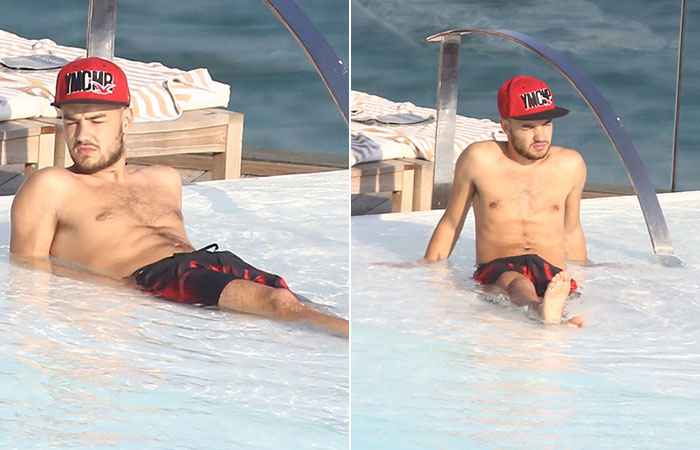 One Direction curte piscina no hotel e Liam Payne acena para fãs da sacada