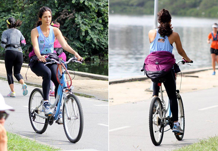 Camila Pitanga relaxa pedalando na orla da Lagoa