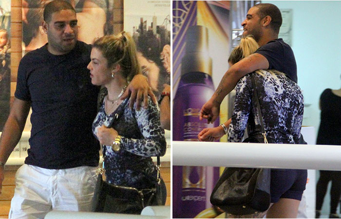  Jogador Adriano troca carícias com loira em shopping carioca