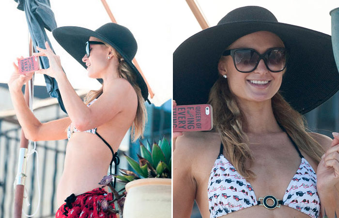  Paris Hilton usa chapéu enorme para comprar prancha