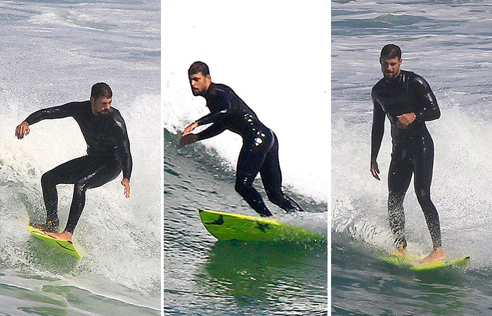  Dia de cair na água! Cauã Reymond faz alongamento antes de surf no Rio