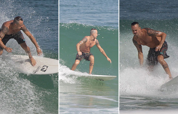 Paulo Vilhena exibe o cabelo moicano em dia de surfe no Rio