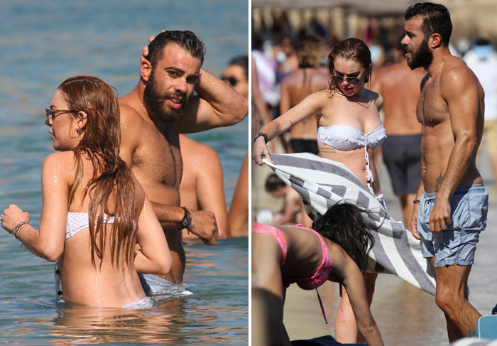 Acompanhada por moreno misterioso, Lindsay Lohan curte mar da Grécia