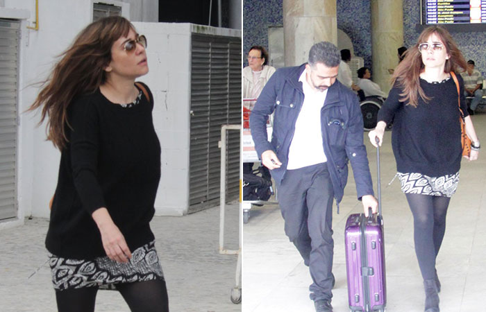 Miguel Falabella e Alessandra Negrini circulam por aeroporto no Rio