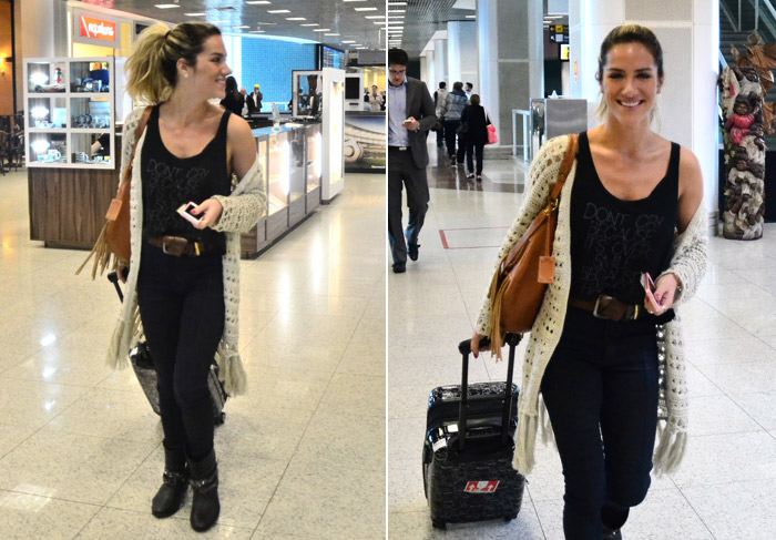 Giovanna Ewbank embarca sorridente no aeroporto Santos Dumont