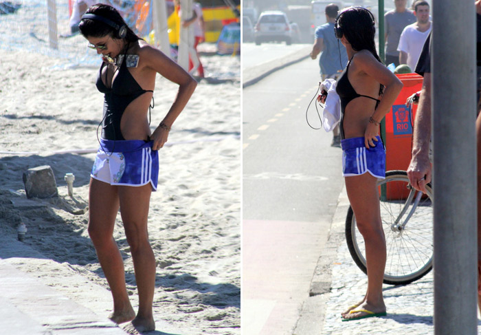 De maiô frente única e short, Anna Lima faz corrida nas areias do Rio de Janeiro 